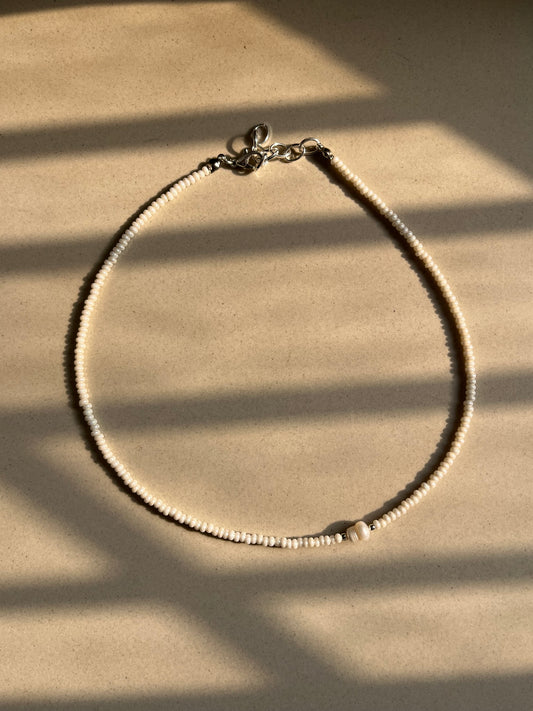 Off centre pearl beaded necklace